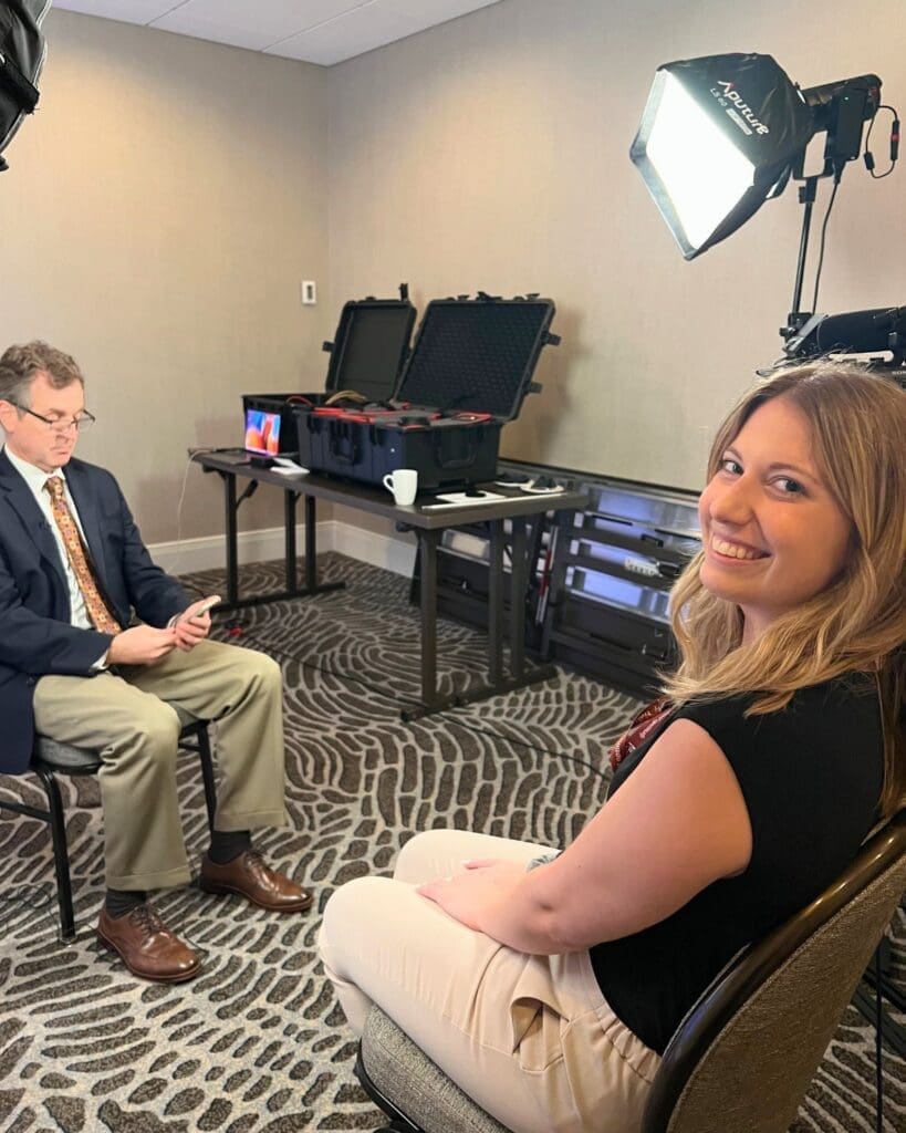 Photo of Katie smiling at camera during interview at NCVH