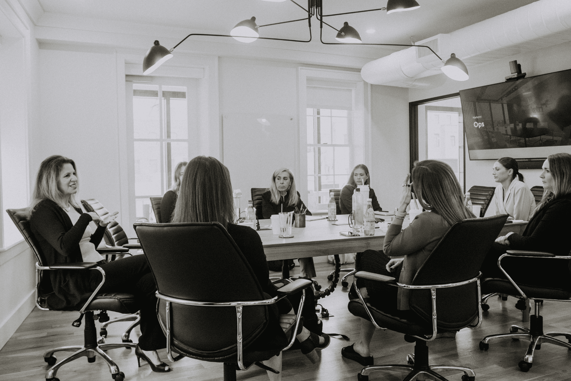 Marketri team seated around large conference table during working session